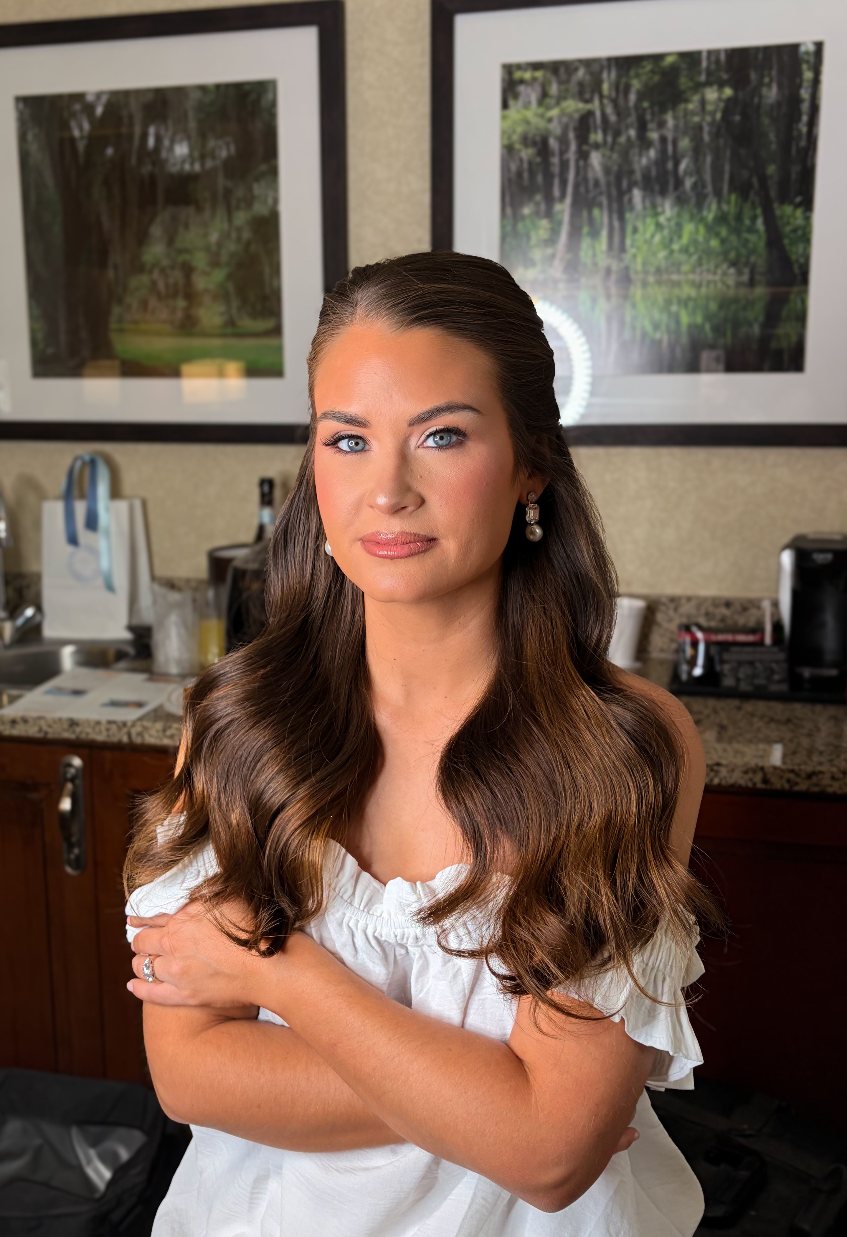 Client with long, glossy brunette waves swept back from her face